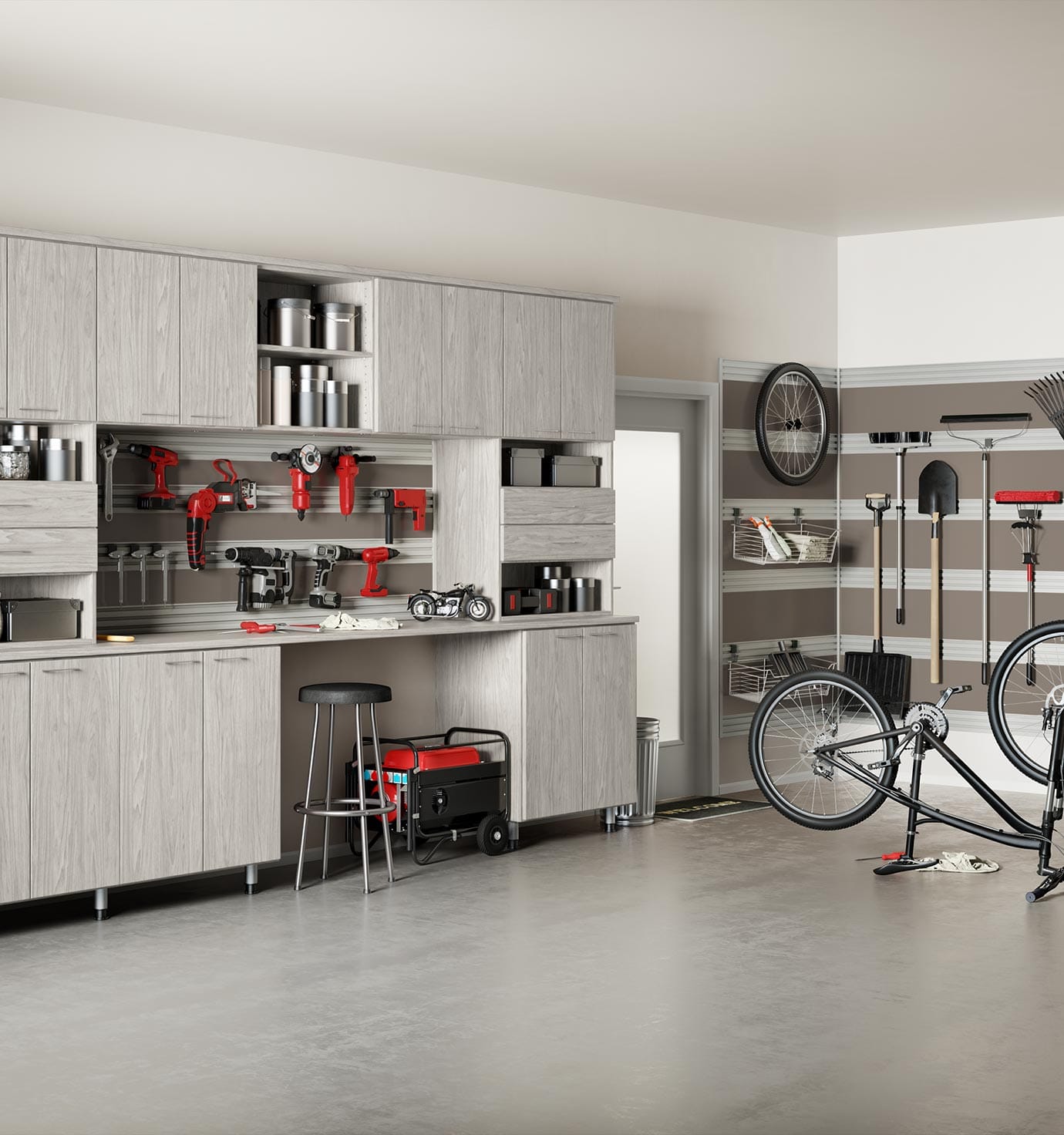 Custom garage storage solutions with bench, drawers, and workbench by California Closets