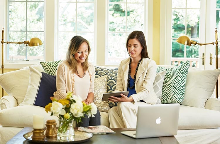 Home design consultation with designer reviewing samples from California Closets